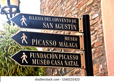 Malaga, Spain - 1.11.2019: Street Signs Showing Way To Pablo Picasso Museum