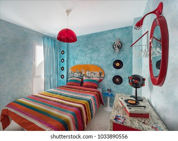 Malaga, Spain. Circa February 2018. Vintage Bedroom With A 60s Clock, Desk, Records,mirror And Retro Lamp