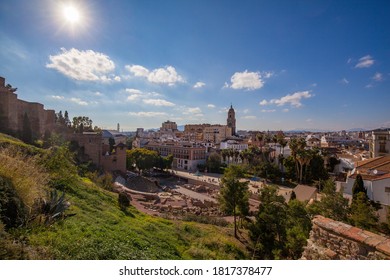 Malaga, Spain Cityscape At The Cathedral, Roman Theater, Picasso Museum And Alcazaba Citadel Of Malaga City. In The Background A Blue Sky And The Mountains Of Andalusia. Aerial View Of Málaga Centro.