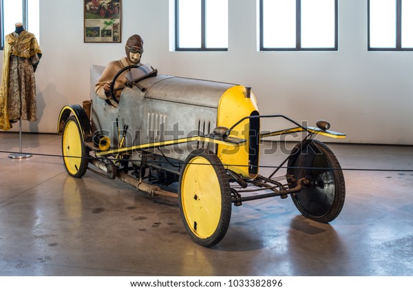 Malaga, Spain - December 7, 2016: El Pampero, an\
original car prototype designed in 1912 in UK by Barron Acroyd, is\
displayed at Malaga Automobile Museum in Spain. Wax driver\'s figure\
in the cabin.