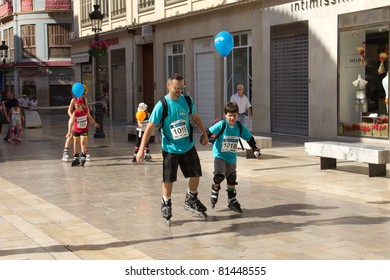 MALAGA, SPAIN - JUNE 19: Unidentified participants skate at the 6th Skate Day race on June 19, 2011 in Malaga, Spain - Shutterstock ID 81448555