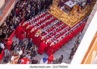 MALAGA, SPAIN - Mar 24, 2016: Procession of Brotherhood of Sagrada Cena, Last Supper, from its temple and manoeuvres through Calle Puerta Nueva in the old town on holy Thursday 
