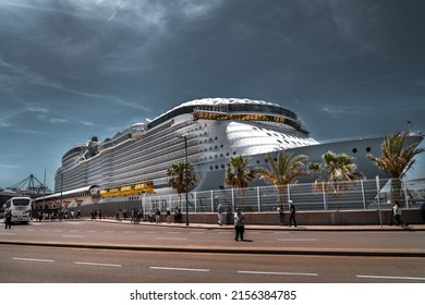 Malaga, SPAIN: May 01 2022: Wonder of the Seas docked in the Port of Malaga. It is the largest cruise ship in the world, owned and operated by Royal Caribbean International. Dramatic edit