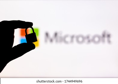 Malaga, Spain - May 18th, 2020: Microsoft Security. Holding a locked padlock besides a Microsoft logo