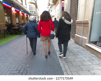 Malaga/Spain : 01-06-2019 : Back View Of Three Generations Of Women Walking Down The Street Together. 