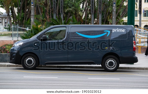 Malaga-Spain-01-15-2021: Amazon\
delivery van car vehicle parked with Prime logo parked outdoor\
downtown a\
city