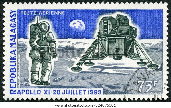 MALAGASY REPUBLIC - CIRCA 1969: A stamp printed in\
Malagasy (Madagascar) shows Apollo 11 Lunar Landing Module and Man\
on the Moon, first anniversary of man\'s first landing on the moon,\
circa 1969