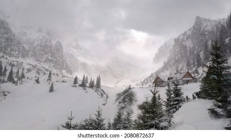 Malaiesti Cabin - Coming blizzard in the background creeping through the mountains - Shutterstock ID 2080872637