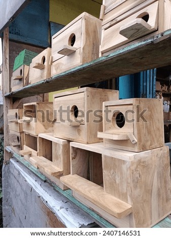 Malang, East Java, Indonesia-January 1 2024: various kinds of equipment needed for raising bird animals including bird cages, bird nesting places and others at the bird market
