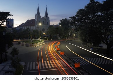 Malang, Indonesia - March 21 2021 : Sacred Heart Of Jesus Catholic Church With Sunrise Sky And Light Trail Long Exposure.