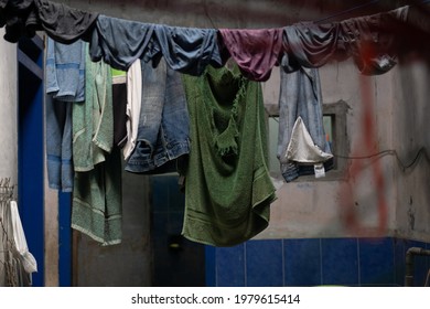 Malang, Indonesia - March 25, 2021: Traditional Clothesline Inside The House With Rope.