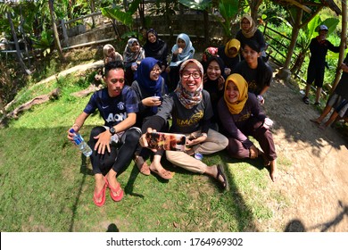 MALANG, INDONESIA - NOVEMBER 03, 2018: A Group People Are Taking Selfie Together Using Fish Eye Lens Ar Hotel Park In Malang, Indonesia.