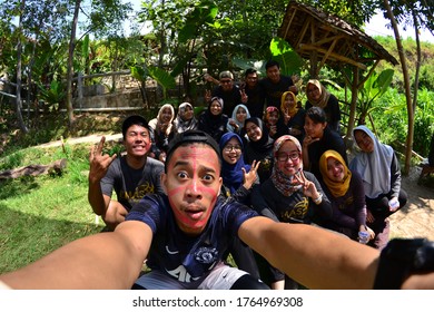 MALANG, INDONESIA - NOVEMBER 03, 2018: A Group People Are Taking Selfie Together Using Fish Eye Lens Ar Hotel Park In Malang, Indonesia.