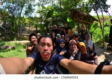 MALANG, INDONESIA - NOVEMBER 03, 2018: A Group People Are Taking Selfie Together Using Fish Eye Lens Ar Hotel Park In Malang, Indonesia.