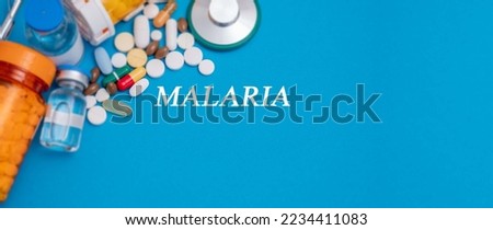 Malaria text  disease on a medical background with medicines