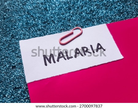 Malaria writting on table background.