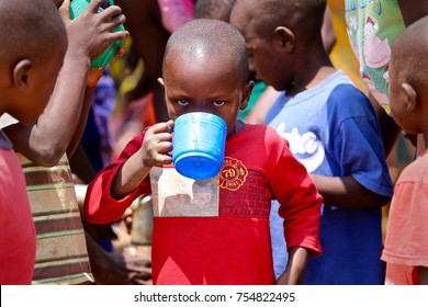 MALAWI, AFRICA, CIRCA SEPTEMBER 2017: An Unidentified African Boy Drinks Clean Water, Free From The Risk Of Cholera.