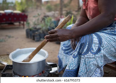 A Malawian Woman Prepares A Traditional African Dish, Known As Nsima In Malawi.