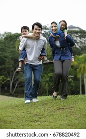 Malay Family Having Fun At The Park