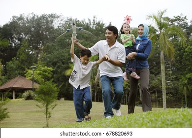 Malay Family Having Fun At The Park