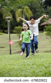 Malay Family Having Fun At The Park