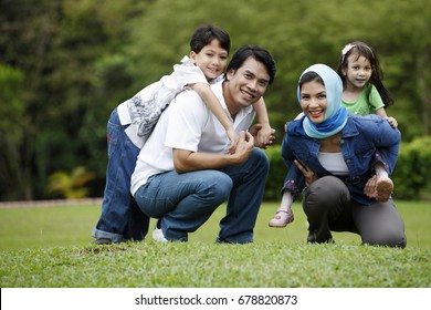 Malay Family Having Fun At The Park