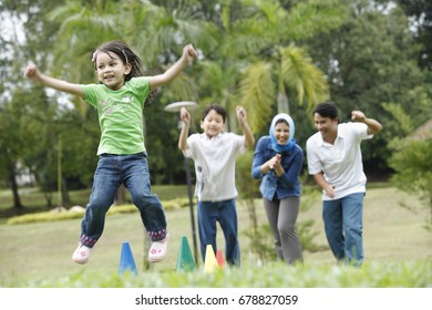 Malay Family Having Fun At The Park