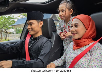 Malay Family Inside The Car Wearing Traditional Costume For Hari Raya Festive