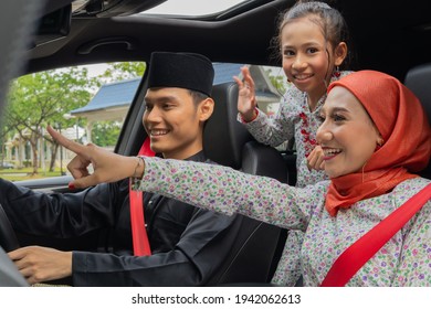 Malay Family Inside The Car Wearing Traditional Costume For Hari Raya Festive