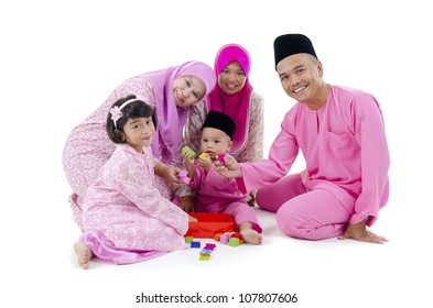 Malay Family In Traditional Malay Clothing