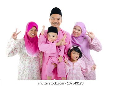 Malay Family In Traditional Malay Clothing