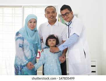 Malay Family Visiting The Doctor