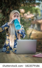 Malay  Girl Student   Drinking Water   At Park