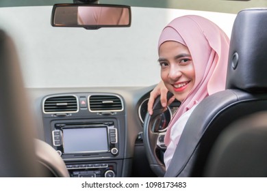 Malay Girl Wearing Hijab Driving Happy Smiling In A Car