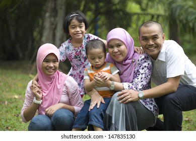 Malay Muslim Family Having Fun In The Park 