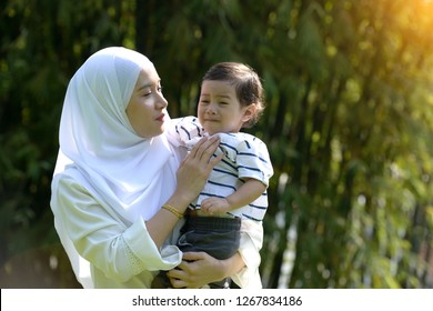 Malay Muslim Mother And Boy Throwing Tantrum