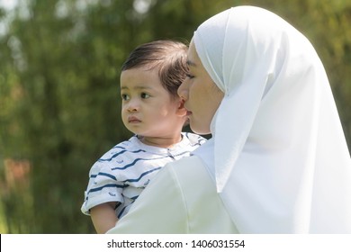 Malay muslim mother and son outdoor