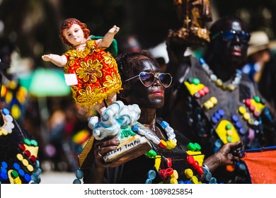 Malay, Philippines - January 10, 2016: a woman carrying a statue of Santo Niño ( Holy Infant ) at the Ati-Atihan Festival at the White Beach in Boracay island,on the municipality of Malay, Philippines