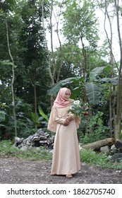 Malay Woman Full Body Hijab Outdoor Holding Flowers. Sarawak Malaysia. November 26, 2020