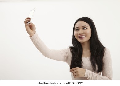 Malay Woman Selfie On The White Background