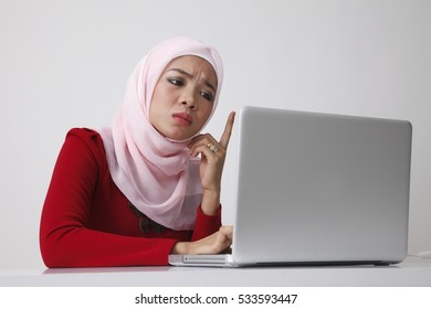 Malay Woman Sitting In Front Of The Laptop Angry And Queries