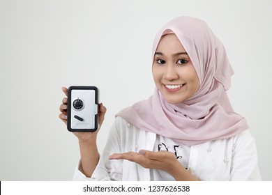 Malay Woman With Tudung Holding A Coin Box