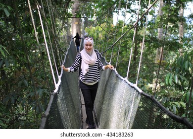 Malay Woman Walking At Ranau Suspension Bridge