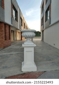 Malaysia, 10 May 2022: Selective focus.A white vintage vase is in the middle of the building.