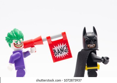 MALAYSIA, April 14, 2018. Mini Figure Of A Joker With Bang Gun And Batman. Lego Minifigures Are Manufactured By The Lego Group.