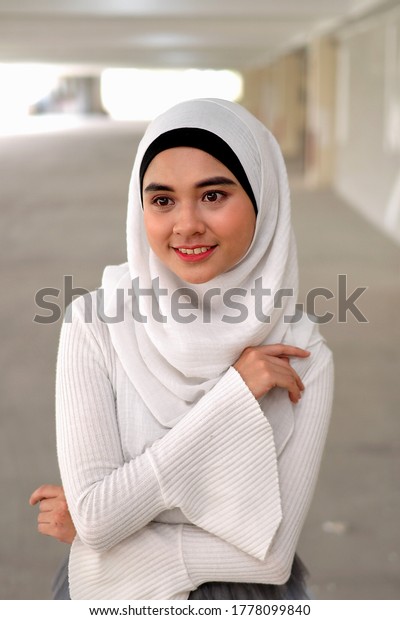 Malaysia, Asian,\
Malay girl wearing white\
dress