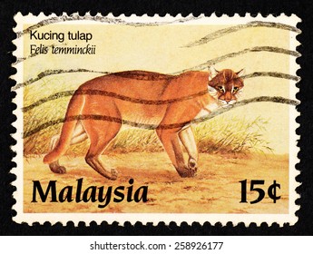 MALAYSIA - CIRCA 1987: Brown Color Postage Stamp Printed In Malaysia With Image Of An Asiatic Golden Cat (Felis Temminckii) For The Protected Wildlife Of Malaysia Series III.