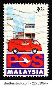 MALAYSIA - CIRCA 1992: Postage Stamp Printed In Malaysia With Caricature Image Of Pos Malaysia Postal Delivery Van.