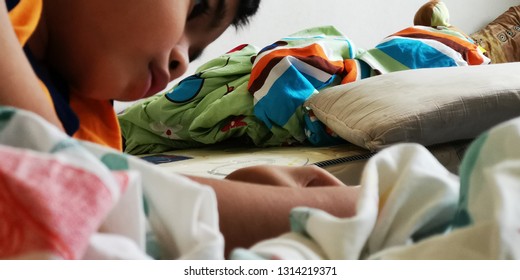 Malaysia - Circa January 2019 : Kid Playing And Watching Youtube Using  Smart Phone Or Tablet.