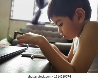 Malaysia - Circa January 2019 : Kid Playing And Watching Youtube Using  Smart Phone Or Tablet.